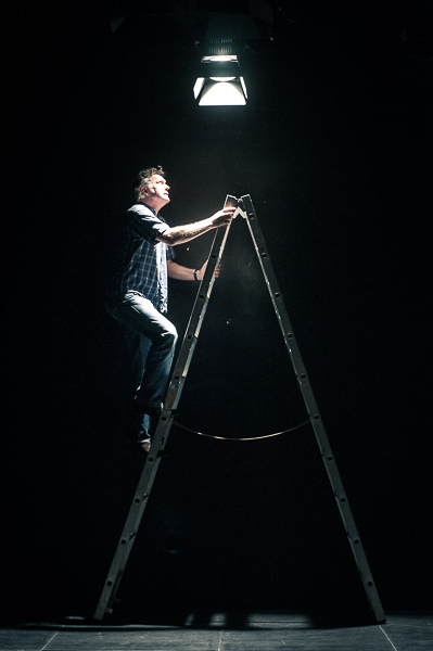 Technician setting up the lights on a ladder